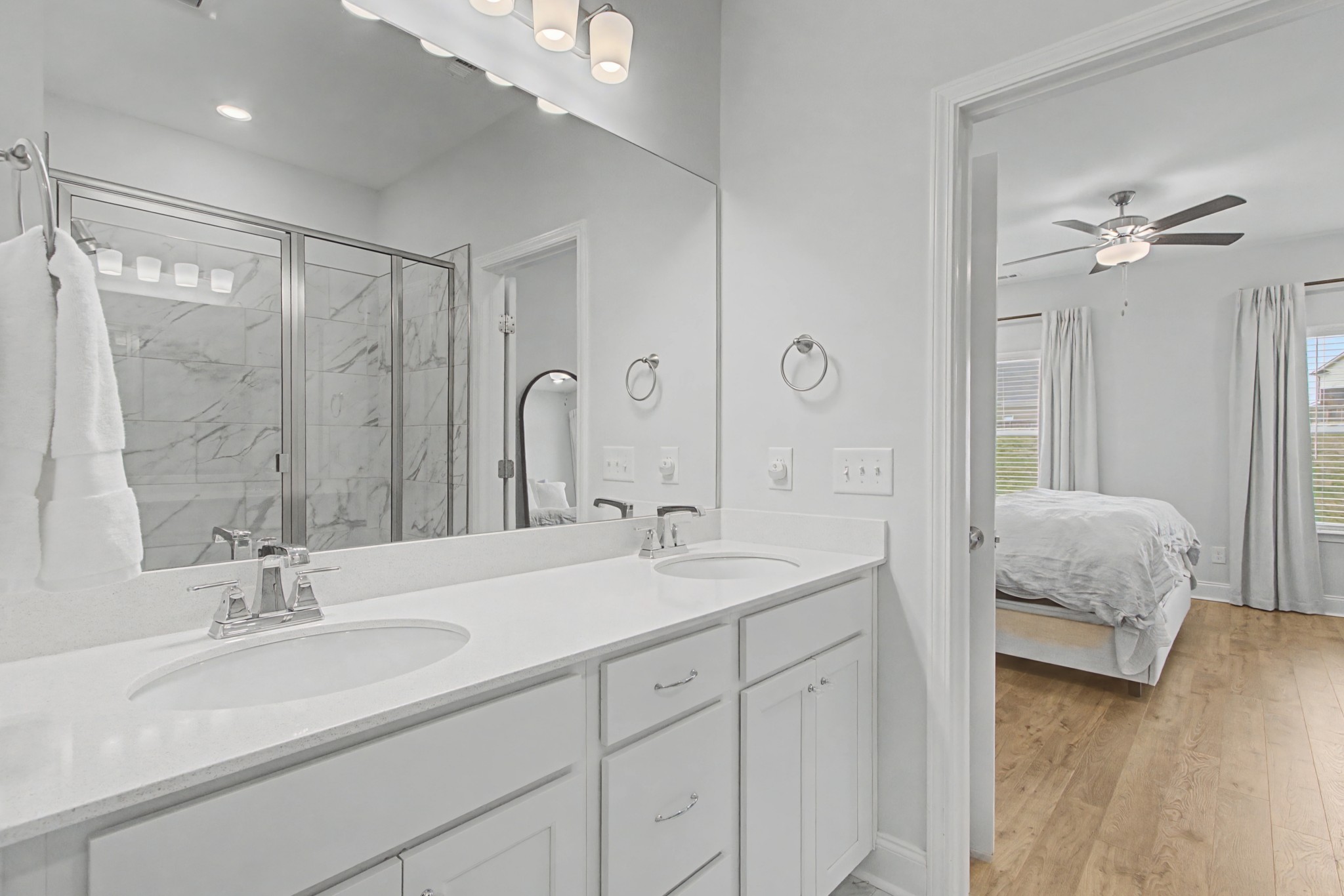 1066 June Wilde Ridge Spring Hill, TN 37174 - Photo 16 of 33 a en suite bathroom with double sink and a mirror