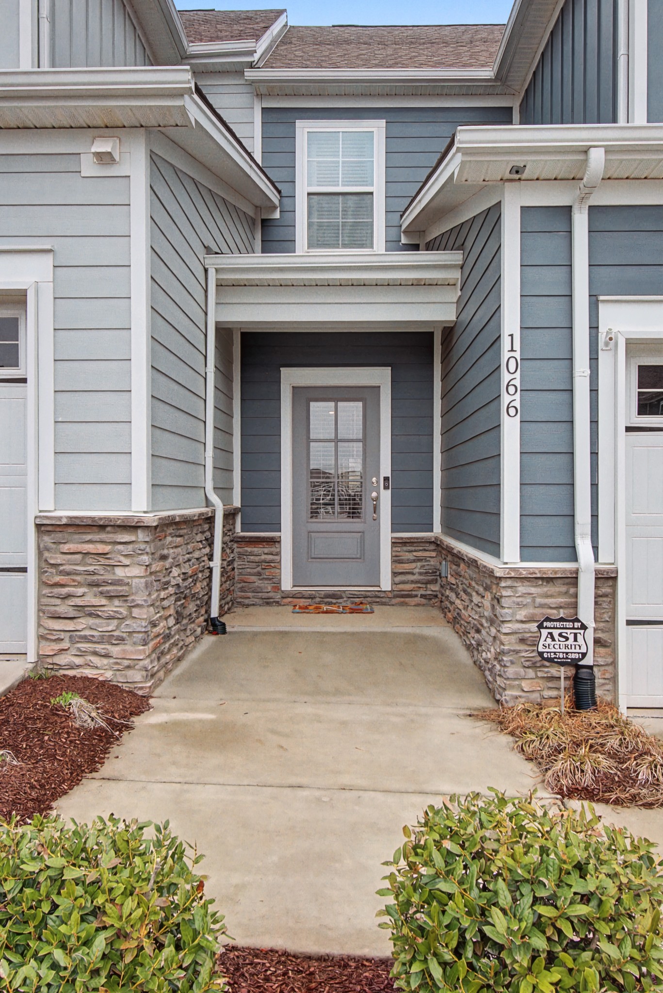 1066 June Wilde Ridge Spring Hill, TN 37174 - Photo 3 of 33 a front view of a house with a garden