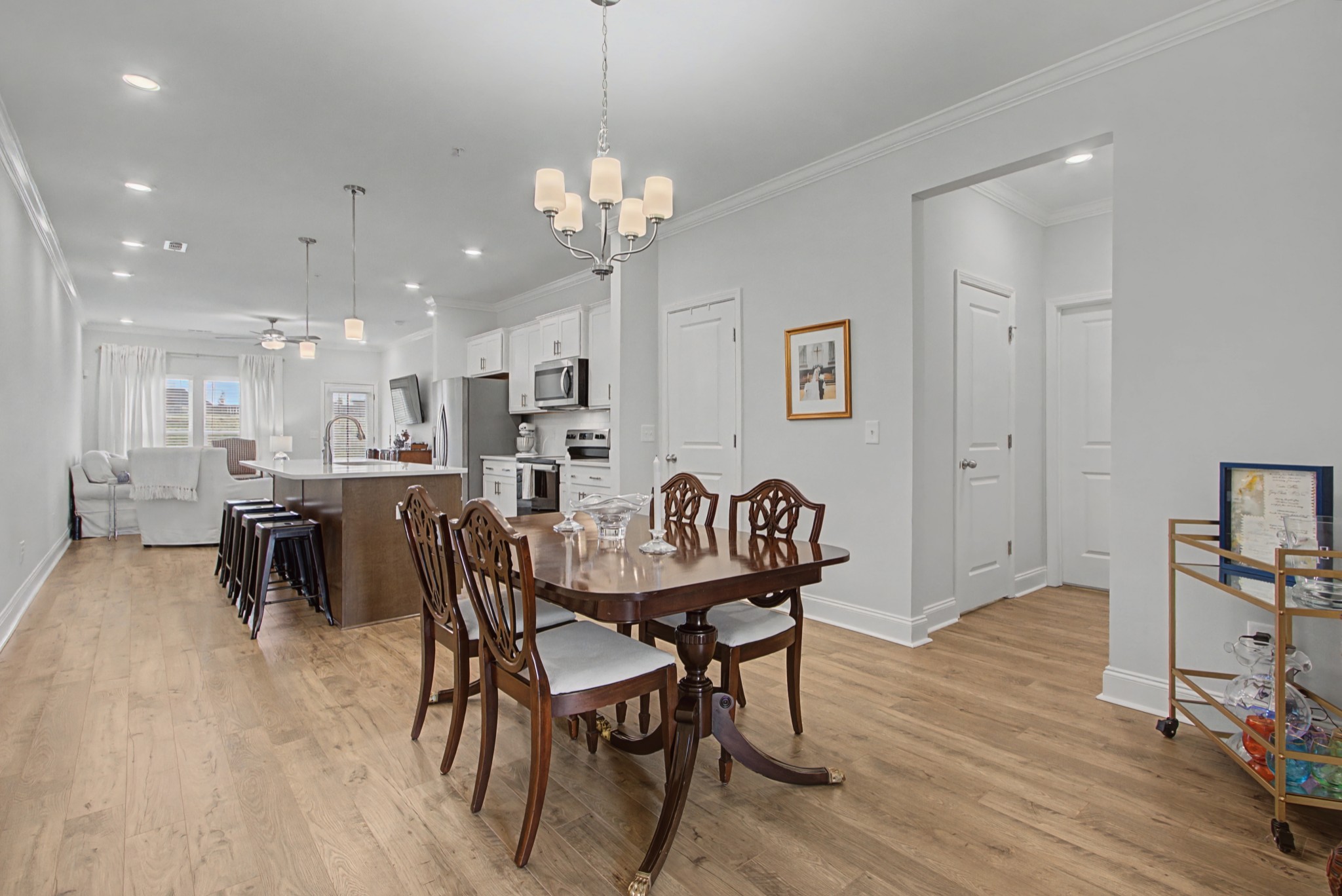 1066 June Wilde Ridge Spring Hill, TN 37174 - Photo 10 of 33 a view of a dining room with furniture and wooden floor