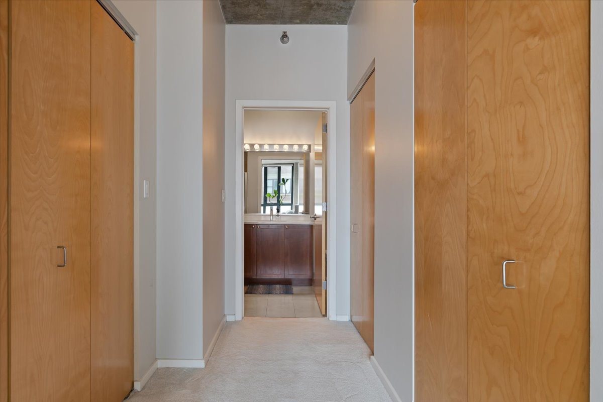 321 South Sangamon Street, Unit 508 Chicago, IL 60607 - Photo 9 of 29 a view of a hallway with a livingroom and a bathroom with sink