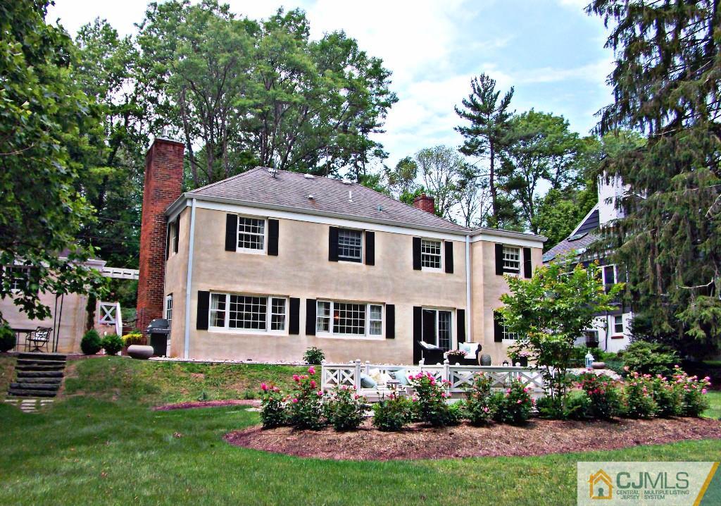 101 Red Hill Road Princeton, NJ 08540 - Photo 1 of 22 a front view of a house with a garden and plants