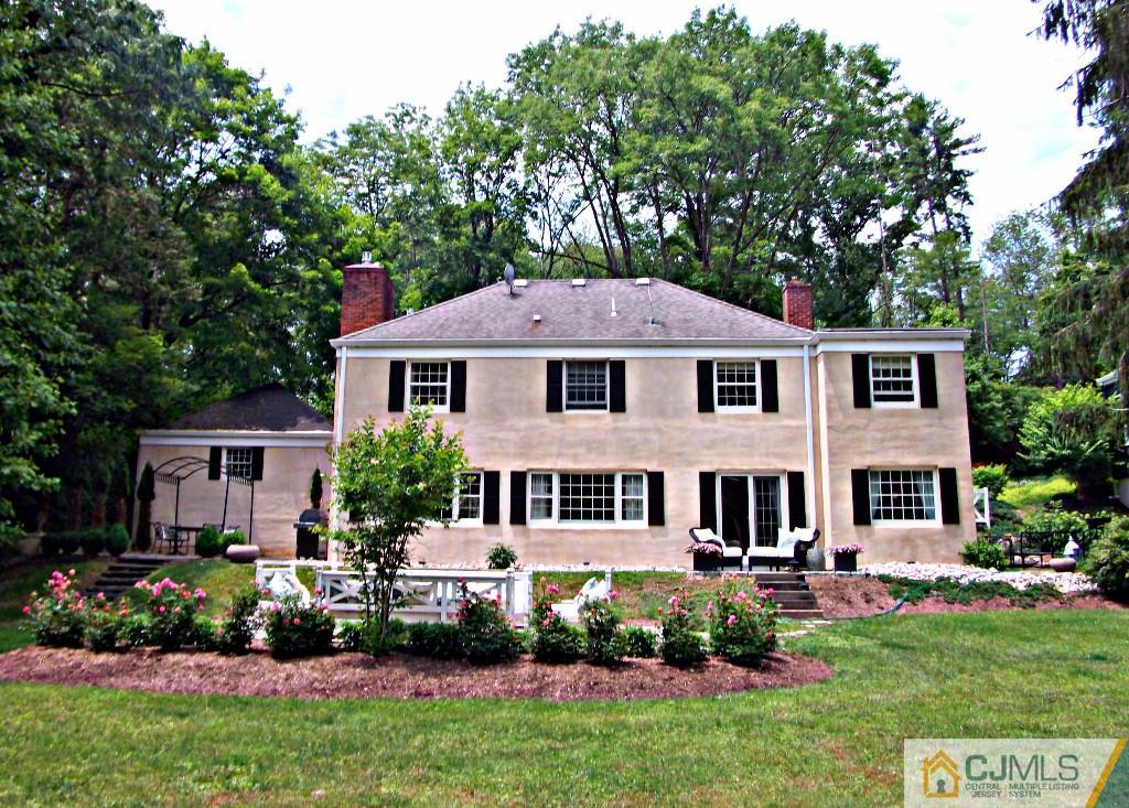 101 Red Hill Road Princeton, NJ 08540 - Photo 2 of 22 a front view of a house with a yard table and chairs