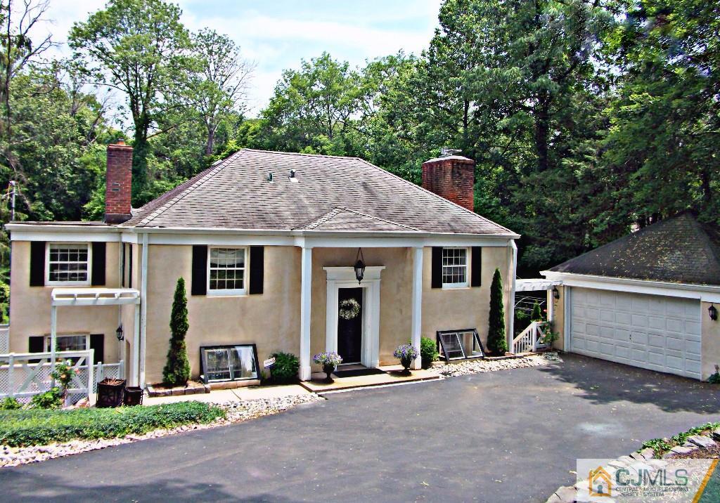 101 Red Hill Road Princeton, NJ 08540 - Photo 14 of 22 a front view of a house with a yard garage and outdoor seating
