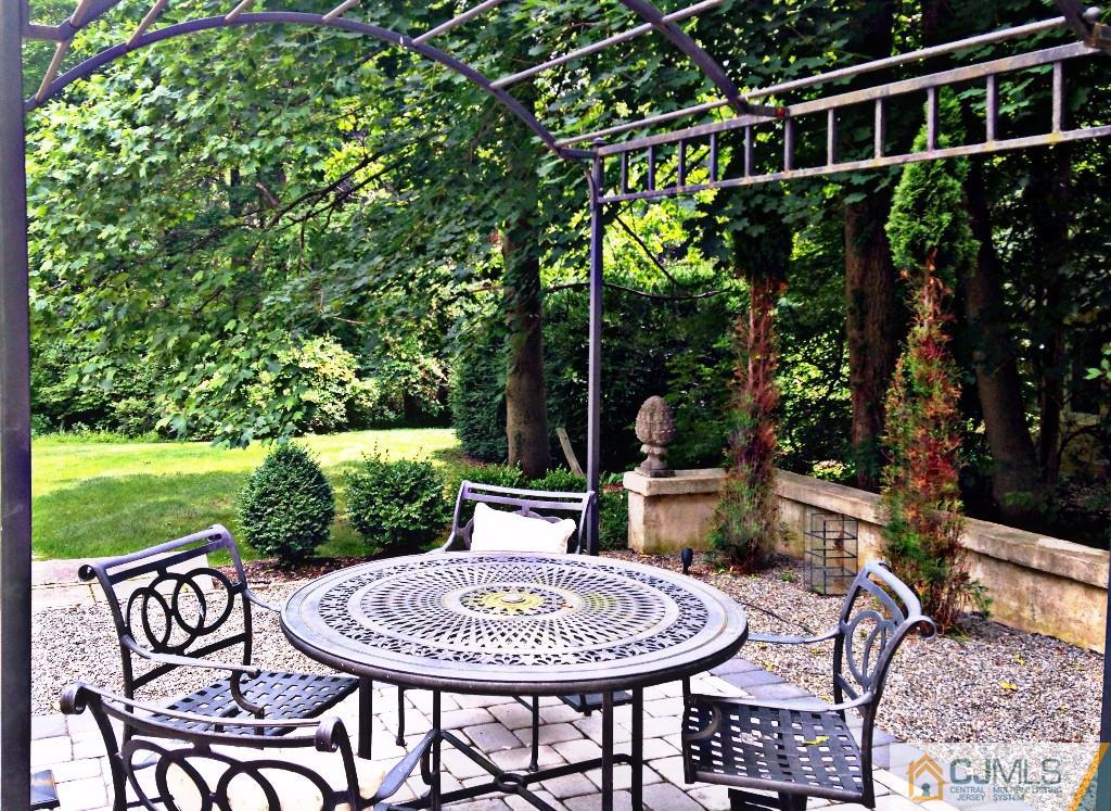 101 Red Hill Road Princeton, NJ 08540 - Photo 15 of 22 a view of a patio with a table chairs and a backyard