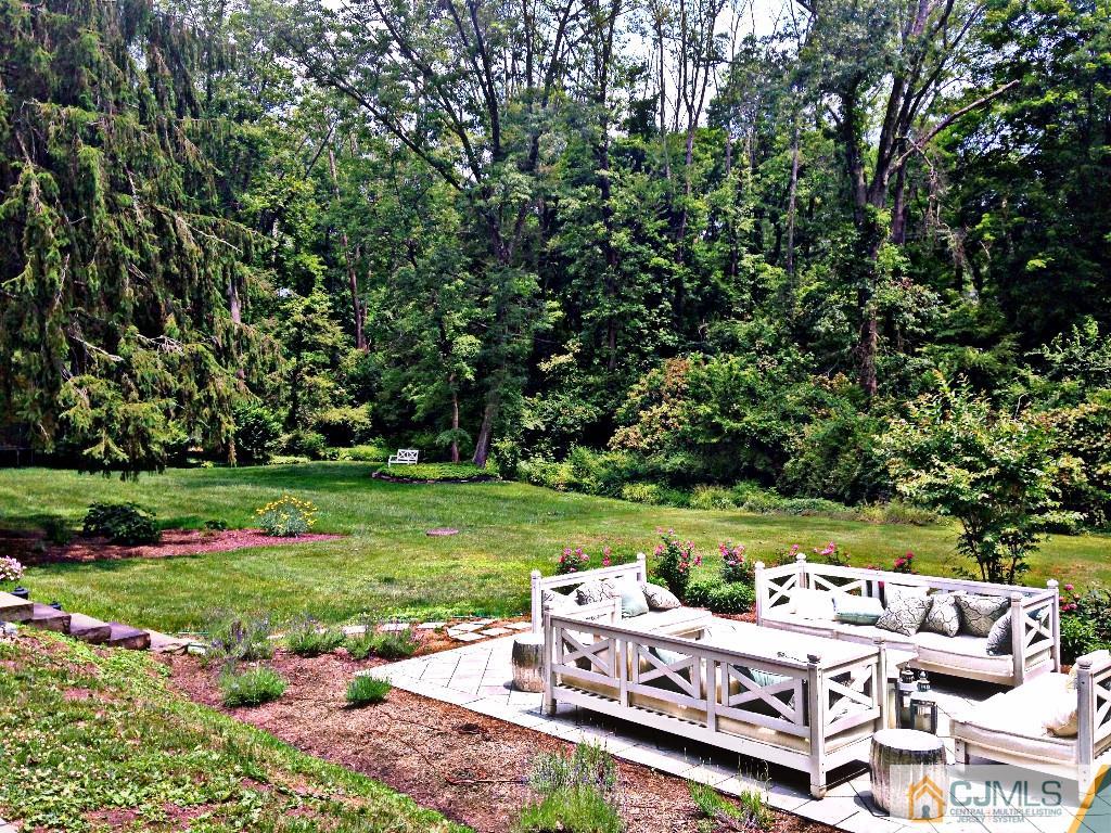 101 Red Hill Road Princeton, NJ 08540 - Photo 17 of 22 a view of a table and chairs in a garden