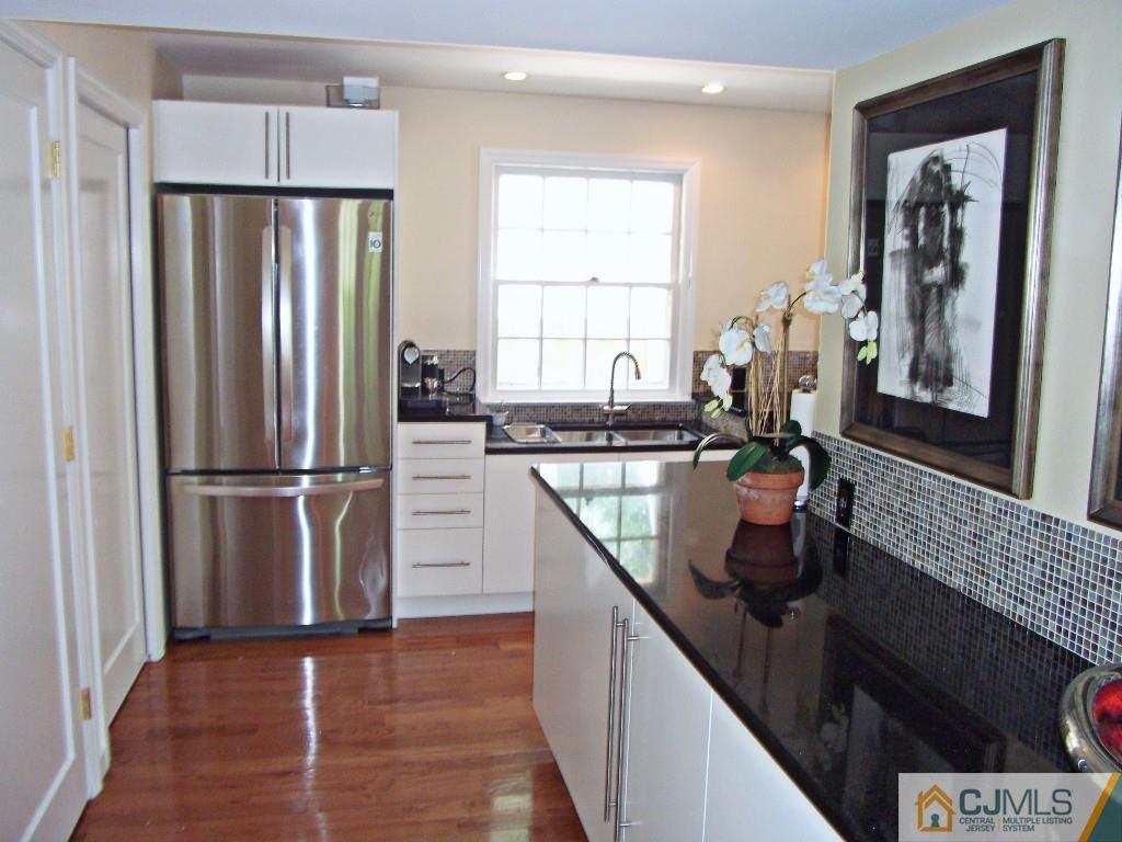 101 Red Hill Road Princeton, NJ 08540 - Photo 7 of 22 a kitchen with stainless steel appliances granite countertop a refrigerator a stove and a sink