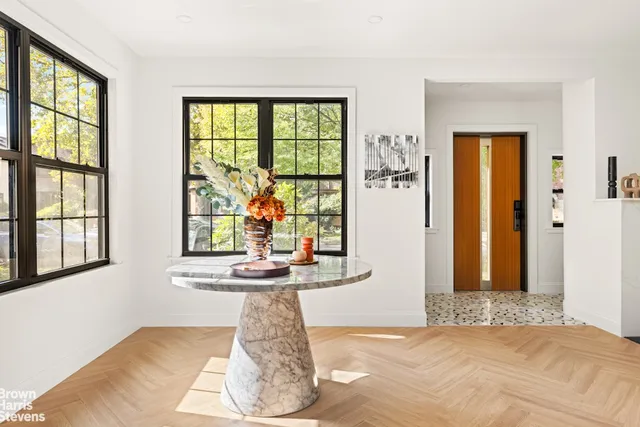a living room with furniture bathtub and a window