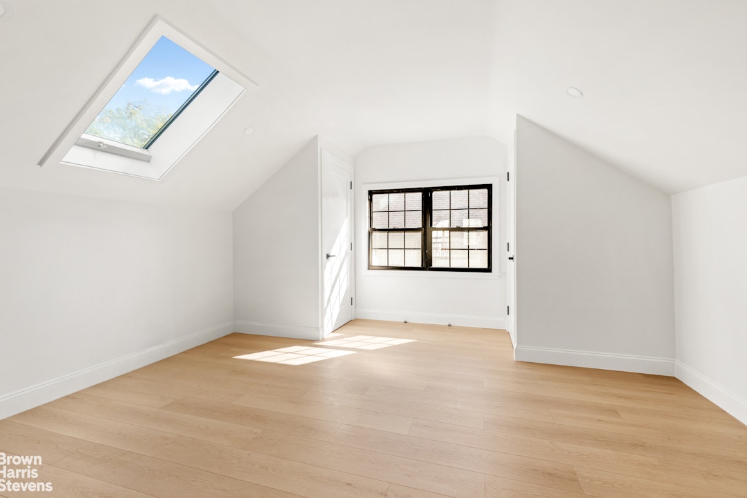 85-03 Wareham Place Queens, NY 11432 - Photo 11 of 21 an empty room with windows