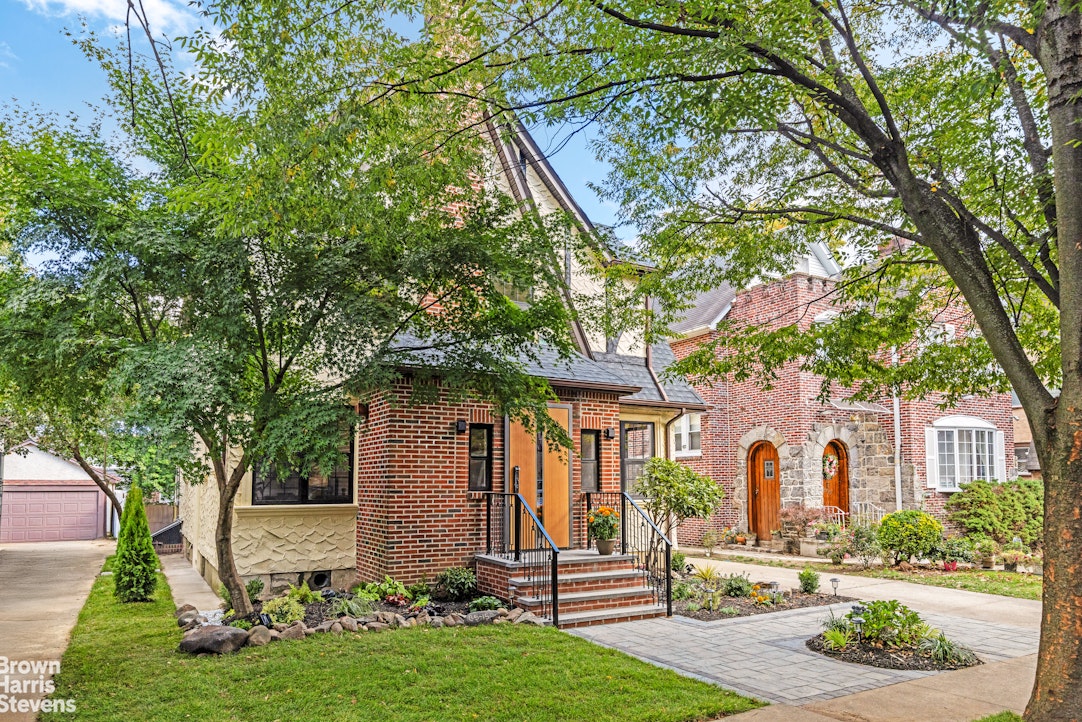 85-03 Wareham Place Queens, NY 11432 - Photo 13 of 21 a front view of a house with a yard