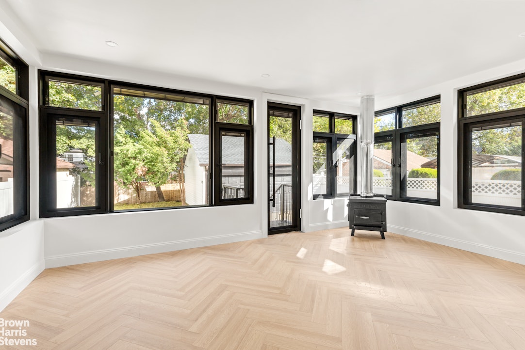 85-03 Wareham Place Queens, NY 11432 - Photo 14 of 21 a view of an empty room with a large window