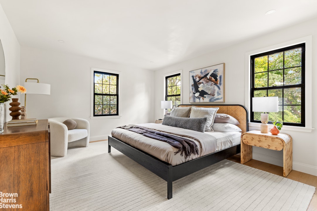 85-03 Wareham Place Queens, NY 11432 - Photo 15 of 21 a spacious bedroom with a bed and a large window