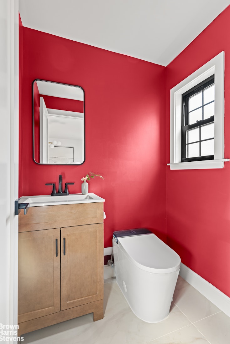 85-03 Wareham Place Queens, NY 11432 - Photo 16 of 21 a bathroom with a sink and a mirror