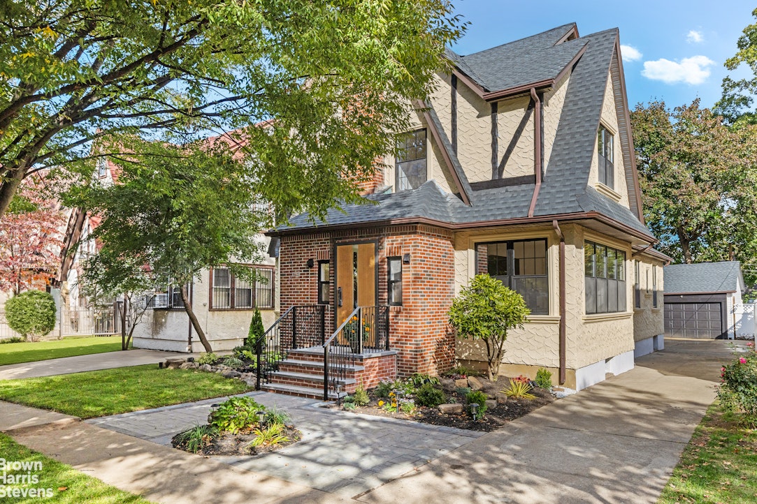 85-03 Wareham Place Queens, NY 11432 - Photo 19 of 21 a front view of a house with garden