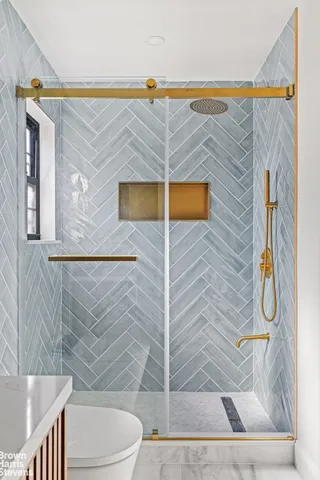 a bathroom with a bathtub and window