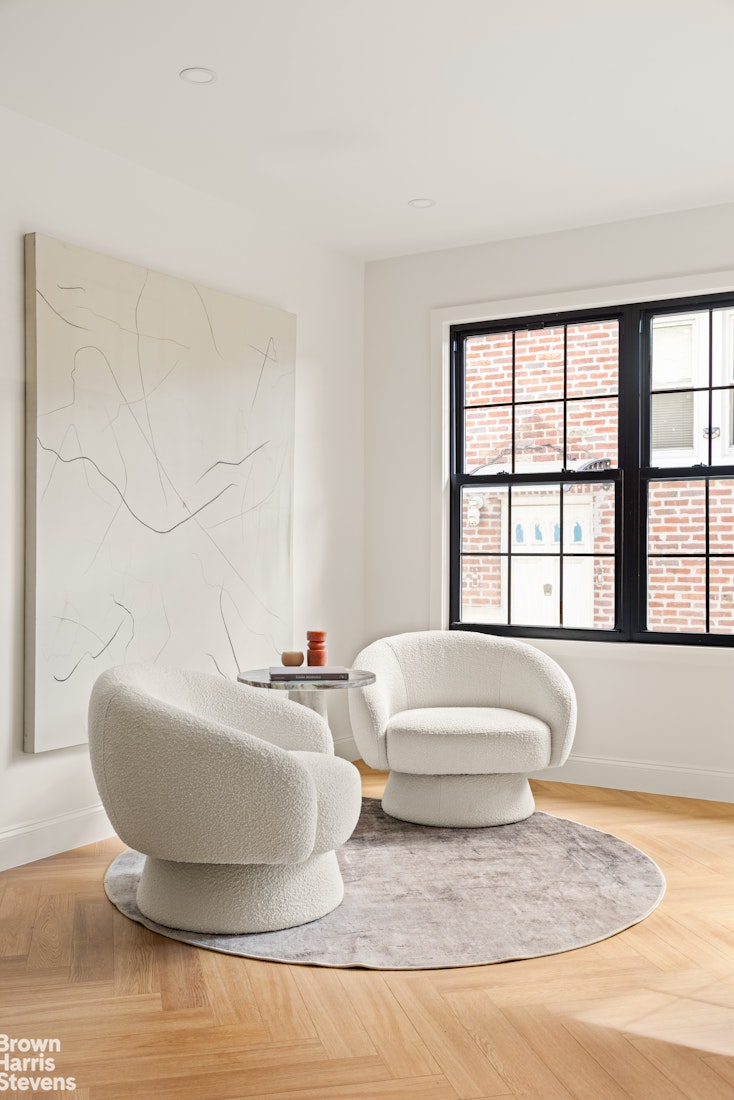 85-03 Wareham Place Queens, NY 11432 - Photo 8 of 21 a bathroom with a bathtub and window