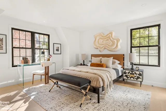 a bedroom with a bed and a couch