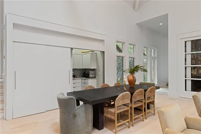 a view of a living room and dining room