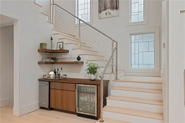 a bedroom with a large bed and a large mirror