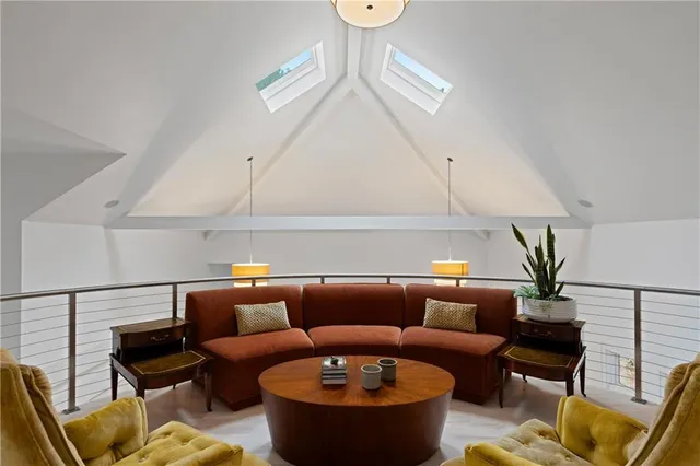 a bedroom with furniture and a rug