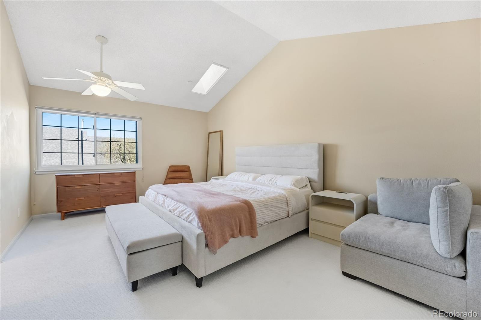 1470 South Quebec Way, Unit 282 Denver, CO 80231 - Photo 14 of 38 a spacious bedroom with a bed and window