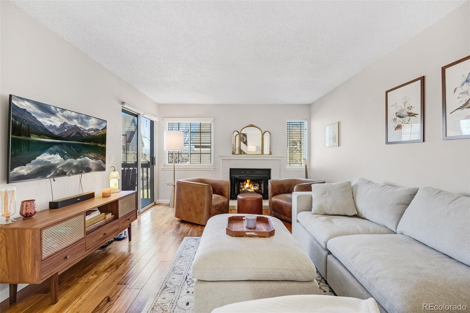 1470 South Quebec Way, Unit 282 Denver, CO 80231 - Photo 2 of 38 a living room with furniture and a window