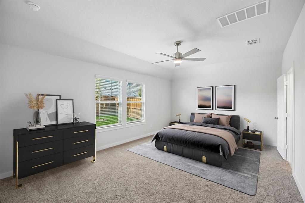 1448 Companero Street Haslet, TX 76052 - Photo 16 of 35 a spacious bedroom with a bed a dresser and a window