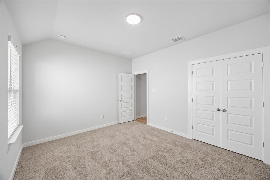 1448 Companero Street Haslet, TX 76052 - Photo 17 of 35 an empty room with closet area