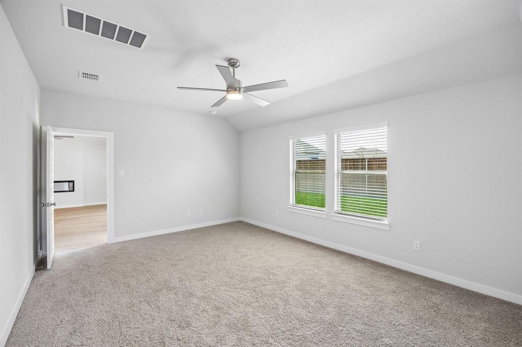 1448 Companero Street Haslet, TX 76052 - Photo 19 of 35 a view of an empty room with a window