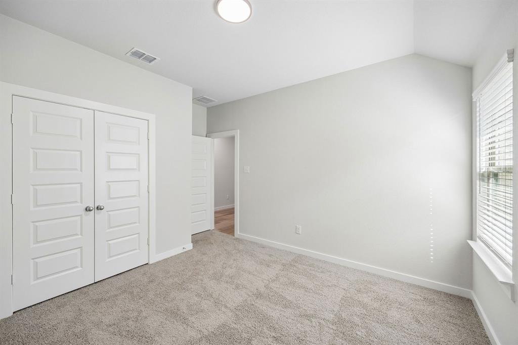 1448 Companero Street Haslet, TX 76052 - Photo 25 of 35 an empty room with windows