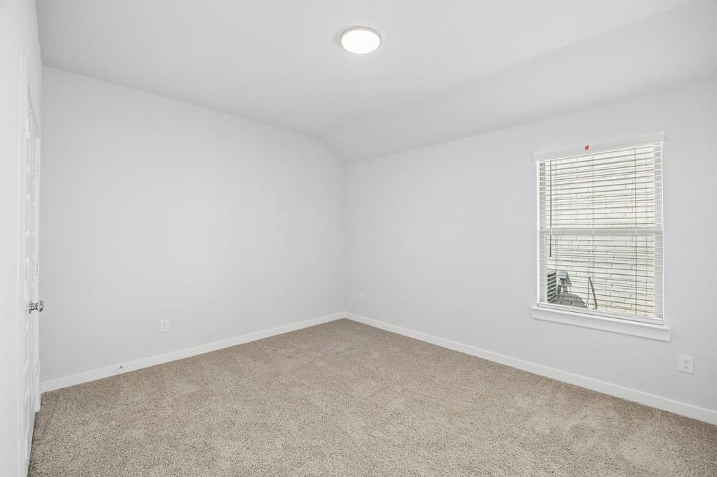 1448 Companero Street Haslet, TX 76052 - Photo 27 of 35 an empty room with a window