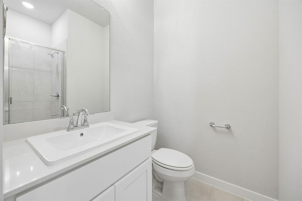 1448 Companero Street Haslet, TX 76052 - Photo 29 of 35 a bathroom with a sink a toilet and shower