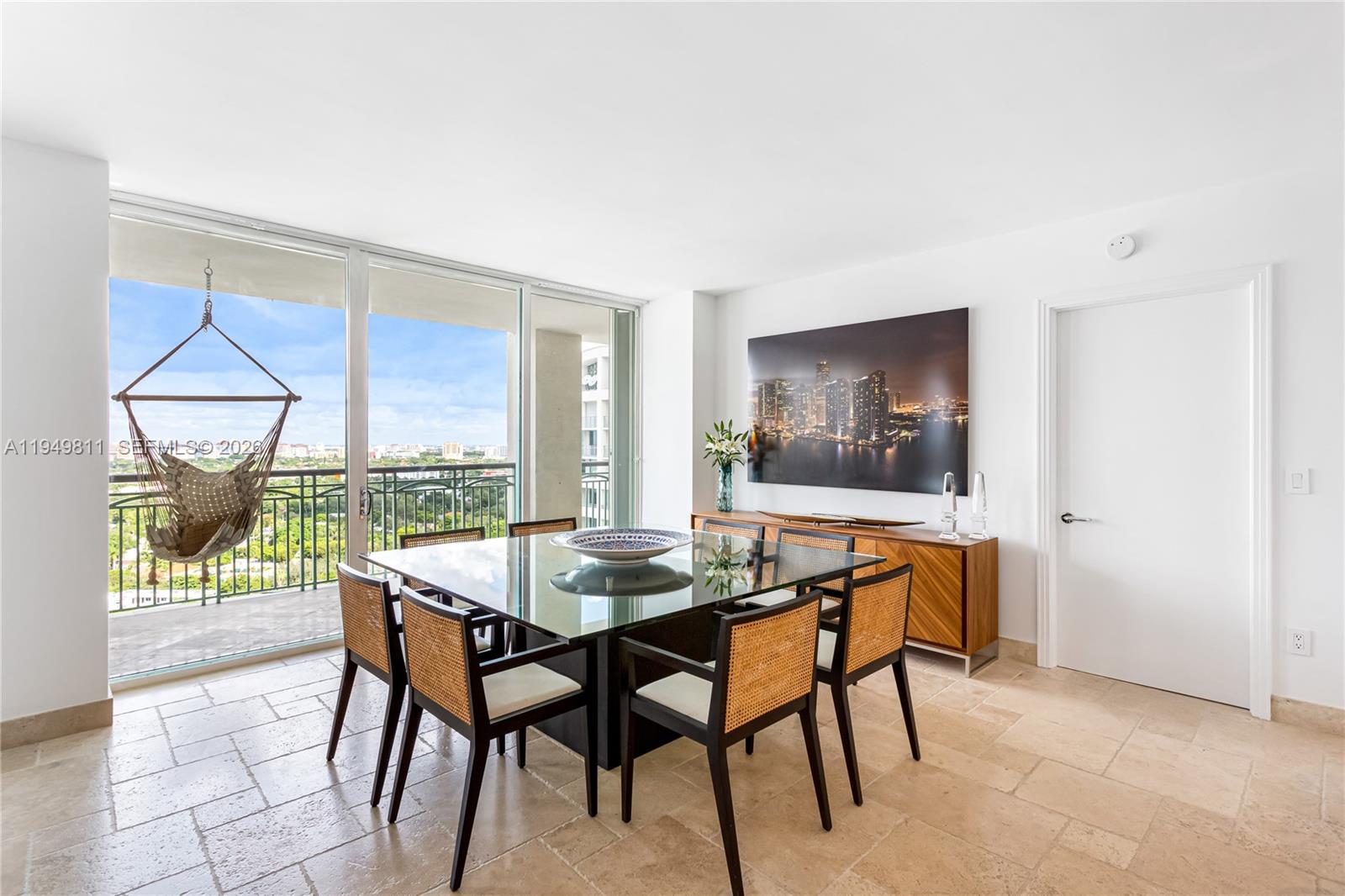 3400 Southwest 27th Avenue, Unit 2104 Miami, FL 33133 - Photo 13 of 26 a dining room with furniture and window