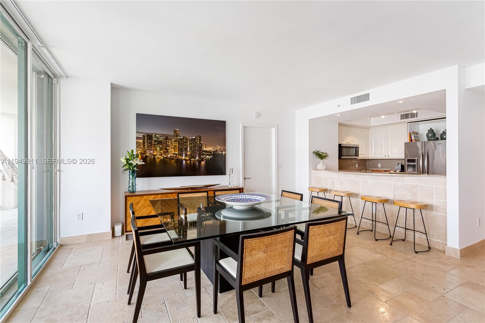 3400 Southwest 27th Avenue, Unit 2104 Miami, FL 33133 - Photo 14 of 26 a dining room with furniture and window