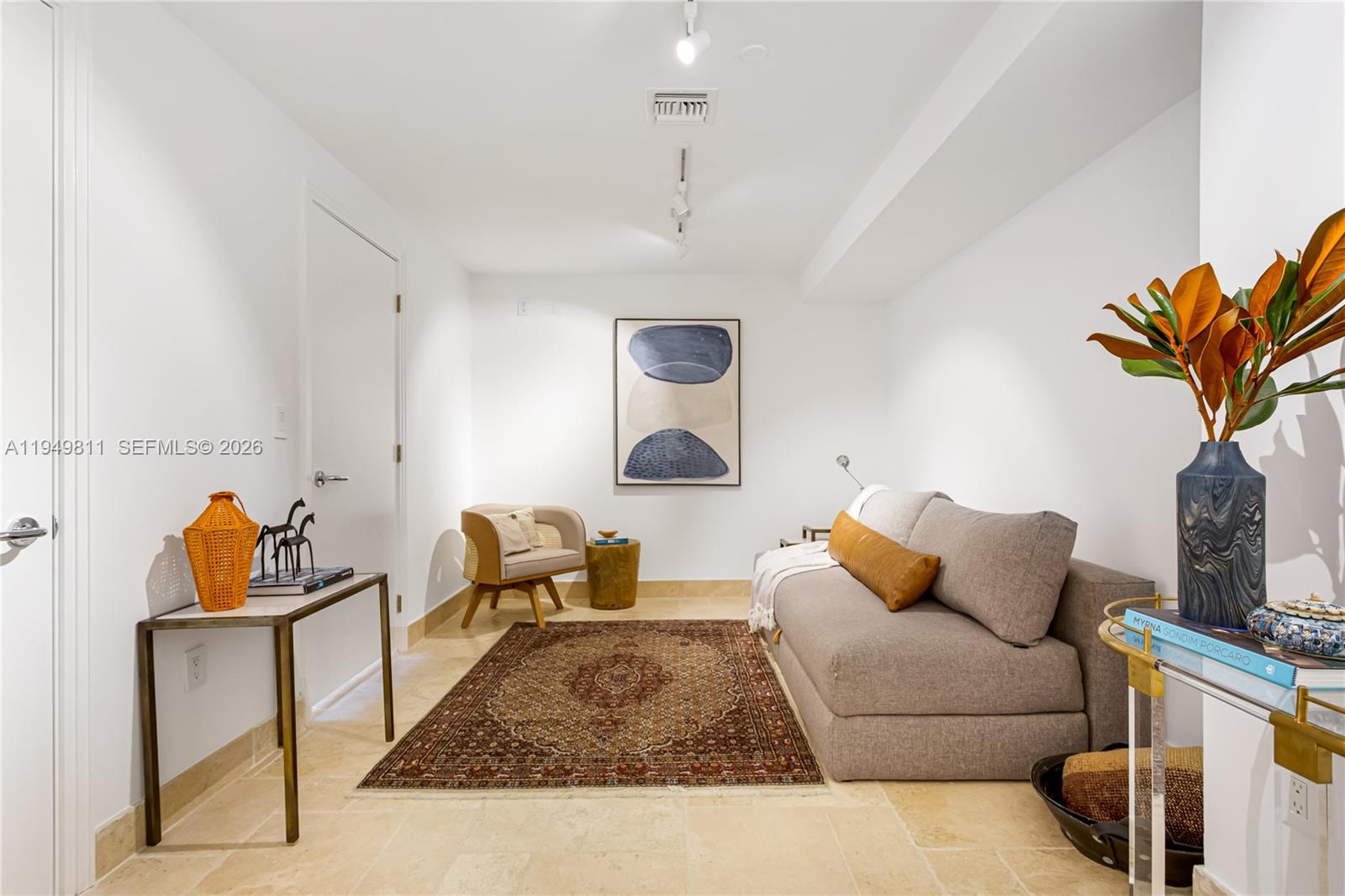 3400 Southwest 27th Avenue, Unit 2104 Miami, FL 33133 - Photo 20 of 26 a living room with furniture and a rug