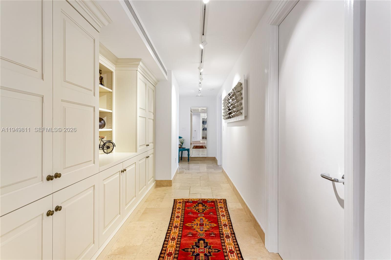 3400 Southwest 27th Avenue, Unit 2104 Miami, FL 33133 - Photo 2 of 26 a view of a hallway with windows