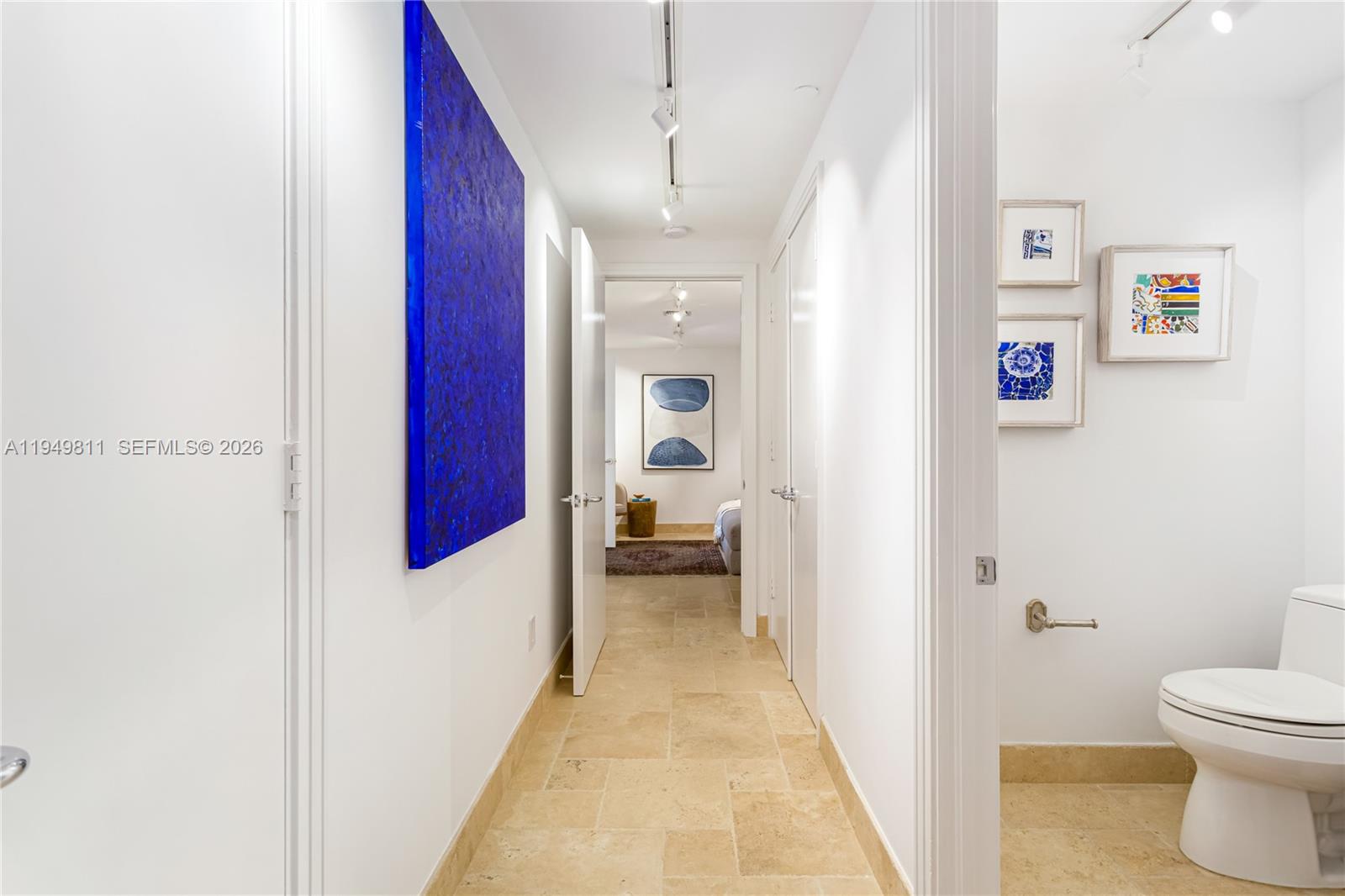 3400 Southwest 27th Avenue, Unit 2104 Miami, FL 33133 - Photo 3 of 26 a bathroom with a toilet and a shower