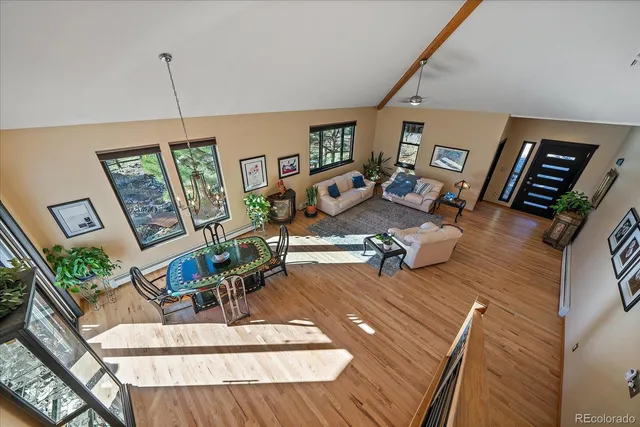 an aerial view of a house with a yard