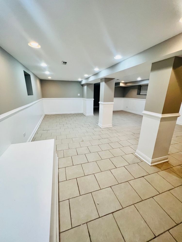 7433 South Perry Avenue Chicago, IL 60621 - Photo 14 of 14 a view of an empty room with wooden floor