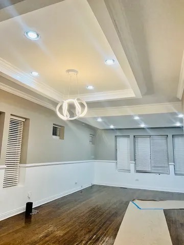 7433 South Perry Avenue Chicago, IL 60621 - Photo 3 of 14 a view of a livingroom with an empty space and a window