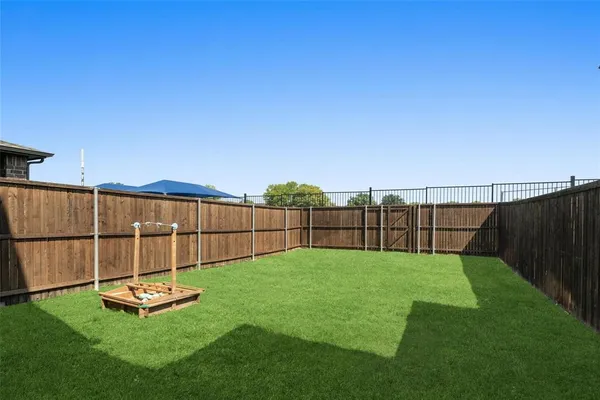 a view of a backyard with a small pool