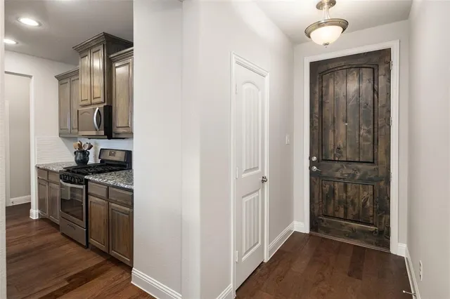 a kitchen with a refrigerator stove and a sink