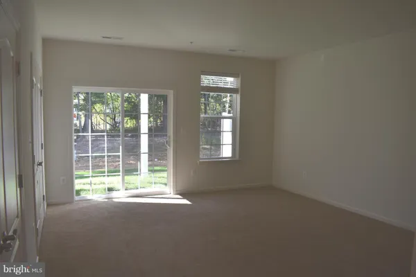 en empty room with windows