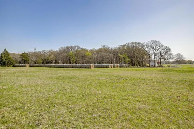 a view of a house with yard and ocean view