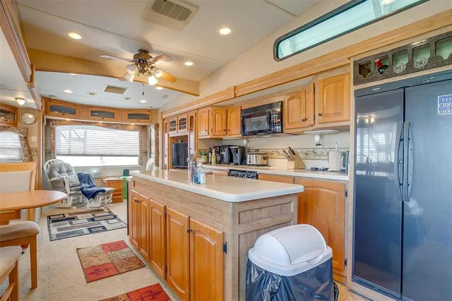a living room with furniture and a dining table