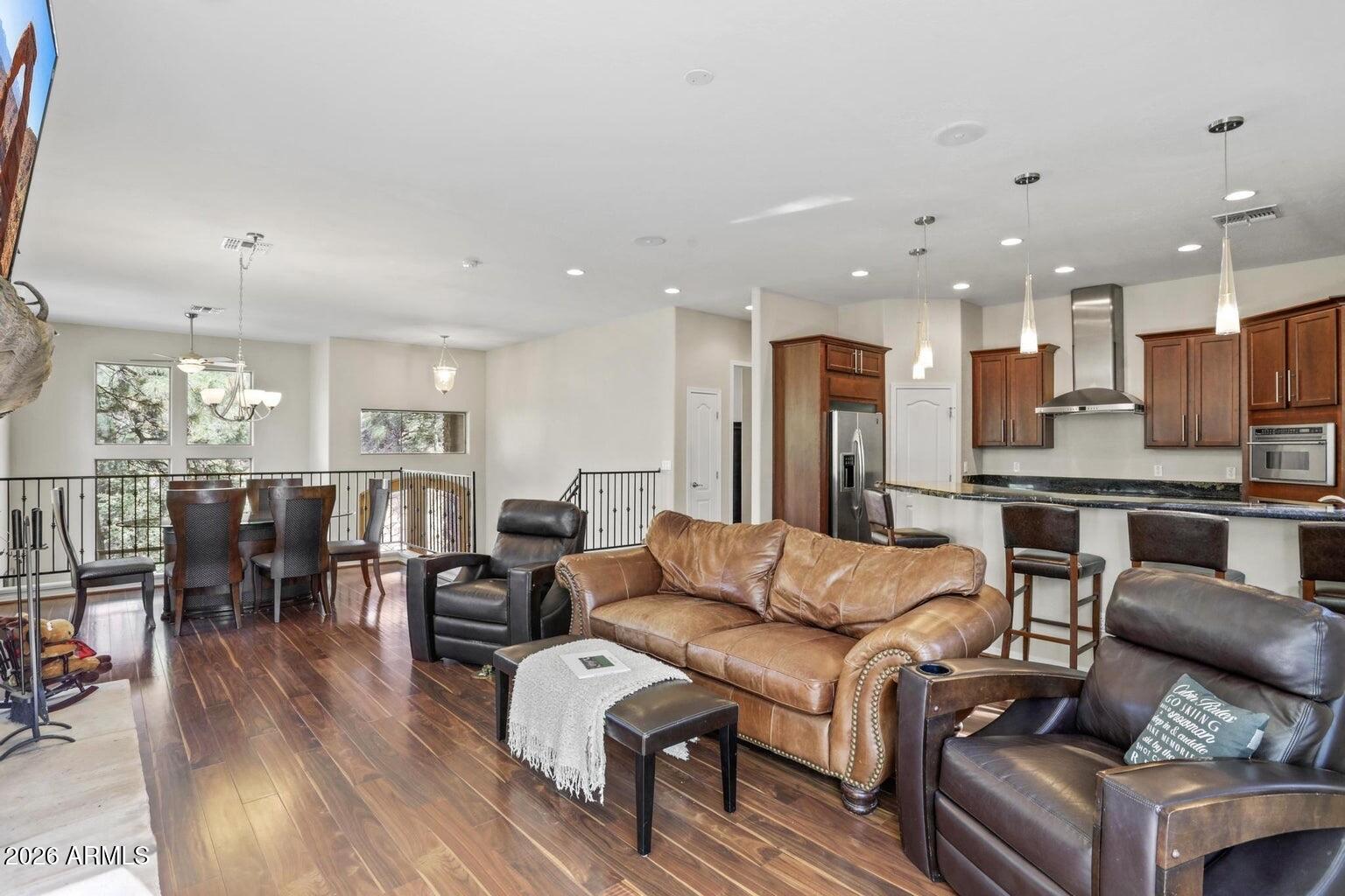 415 East Rim Estates Trail Payson, AZ 85541 - Photo 15 of 76 a living room with furniture kitchen and a wooden floor