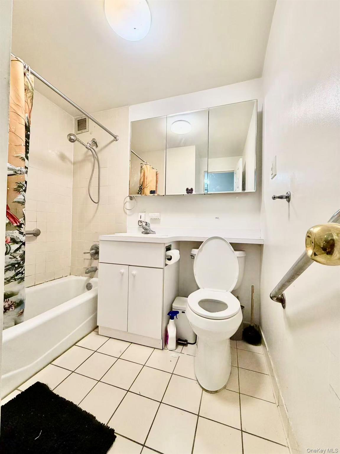 87-14 57th Road, Unit 3B Queens, NY 11373 - Photo 11 of 14 a bathroom with a sink toilet and shower