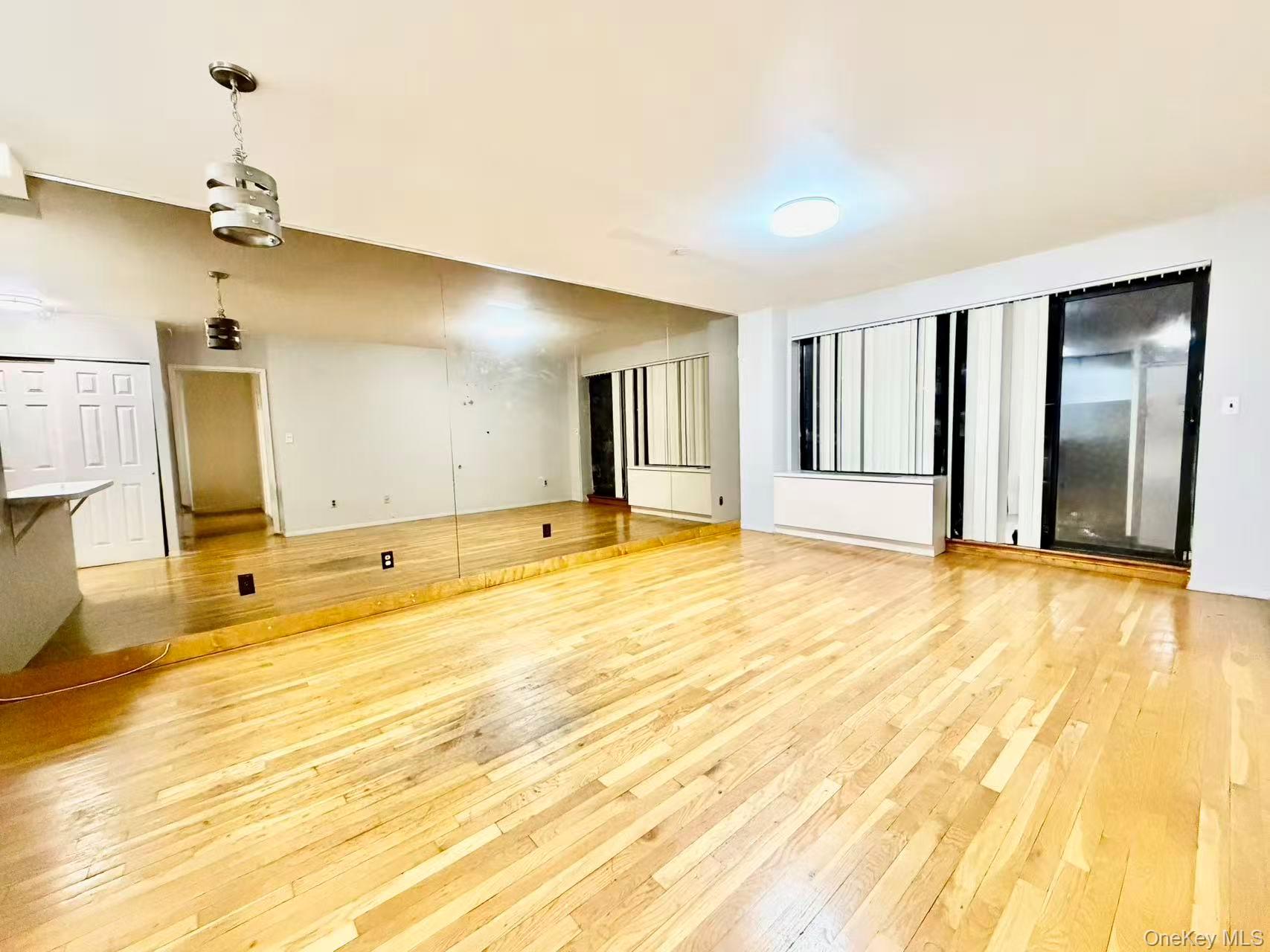 87-14 57th Road, Unit 3B Queens, NY 11373 - Photo 4 of 14 a view of a livingroom with a natural light