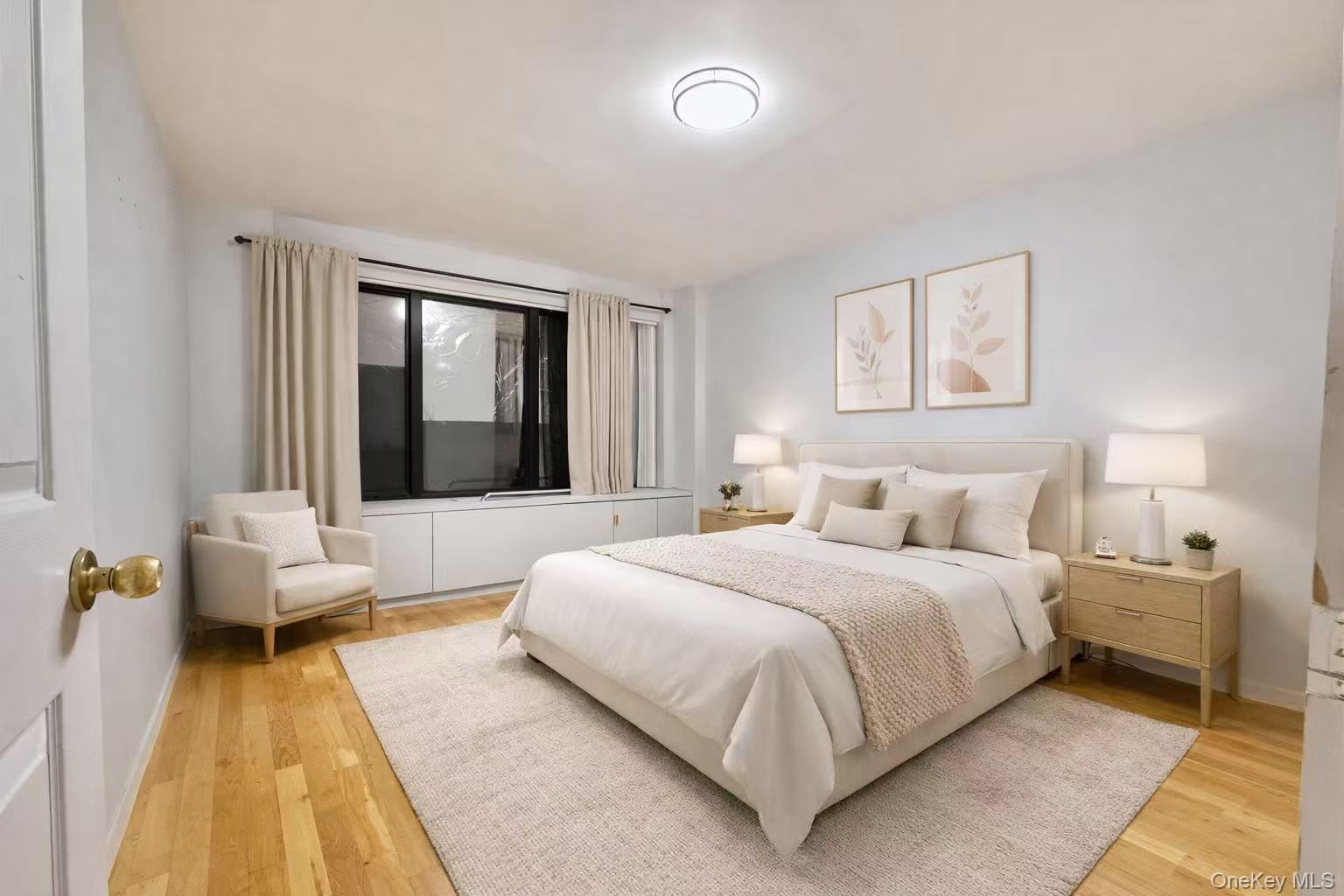 87-14 57th Road, Unit 3B Queens, NY 11373 - Photo 5 of 14 a bedroom with a bed couch and a window