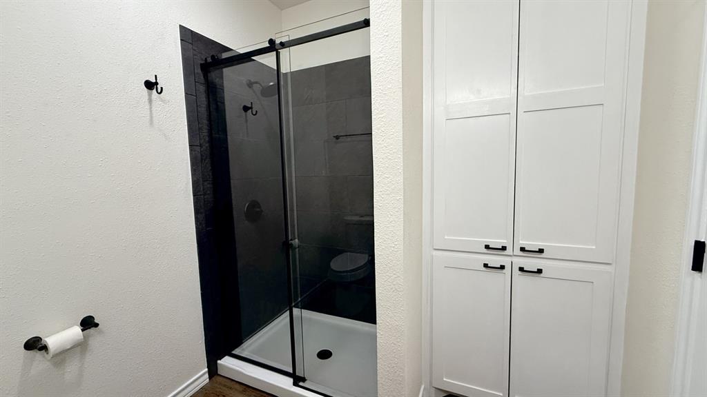 415 Colorado Avenue Graham, TX 76450 - Photo 11 of 16 a bathroom with a shower