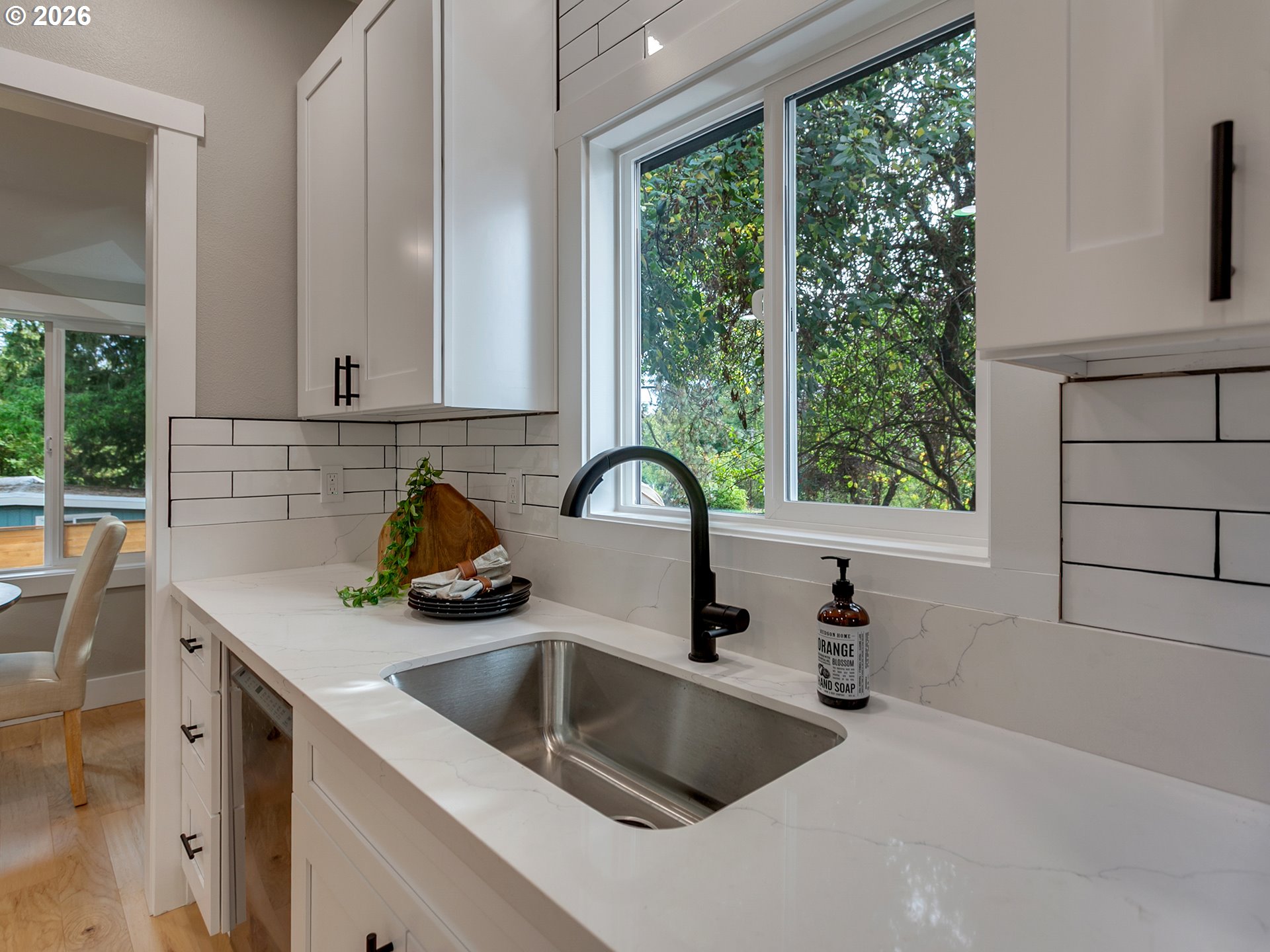 7224 Southwest 3rd Avenue Portland, OR 97219 - Photo 17 of 42 a kitchen with a sink a counter top space and a window